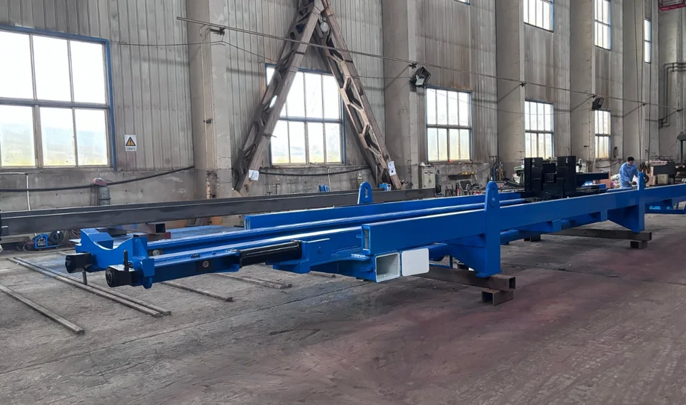 A blue Qingwei tube bundle extractor chassis under assembly in the workshop