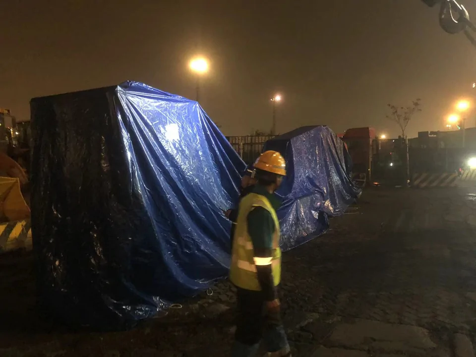 Covered Qingwei tube bundle extractor sections arranged together after unloading at night