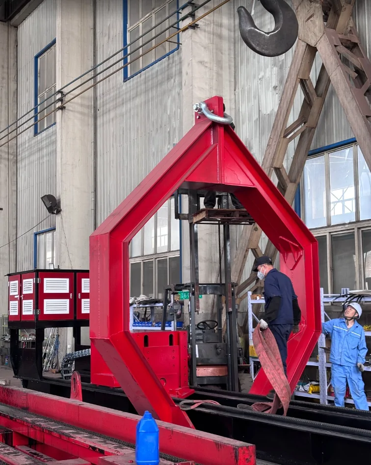 Workers checking the red lifting frame installed on a Qingwei tube bundle extractor