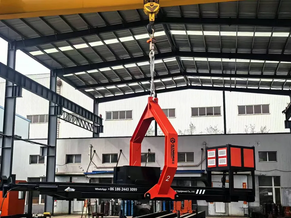 Overhead crane lifting a completed Qingwei tube bundle extractor in the workshop